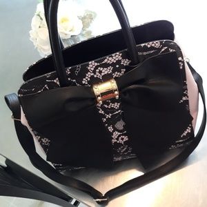 Betsey Johnson hand bag with strap